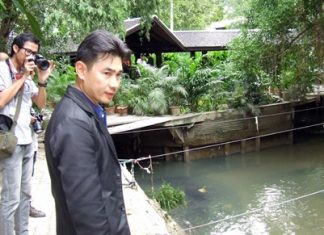 Banglamung District Constable Phongsith Pijnant investigates buildings blocking the South Pattaya canal.